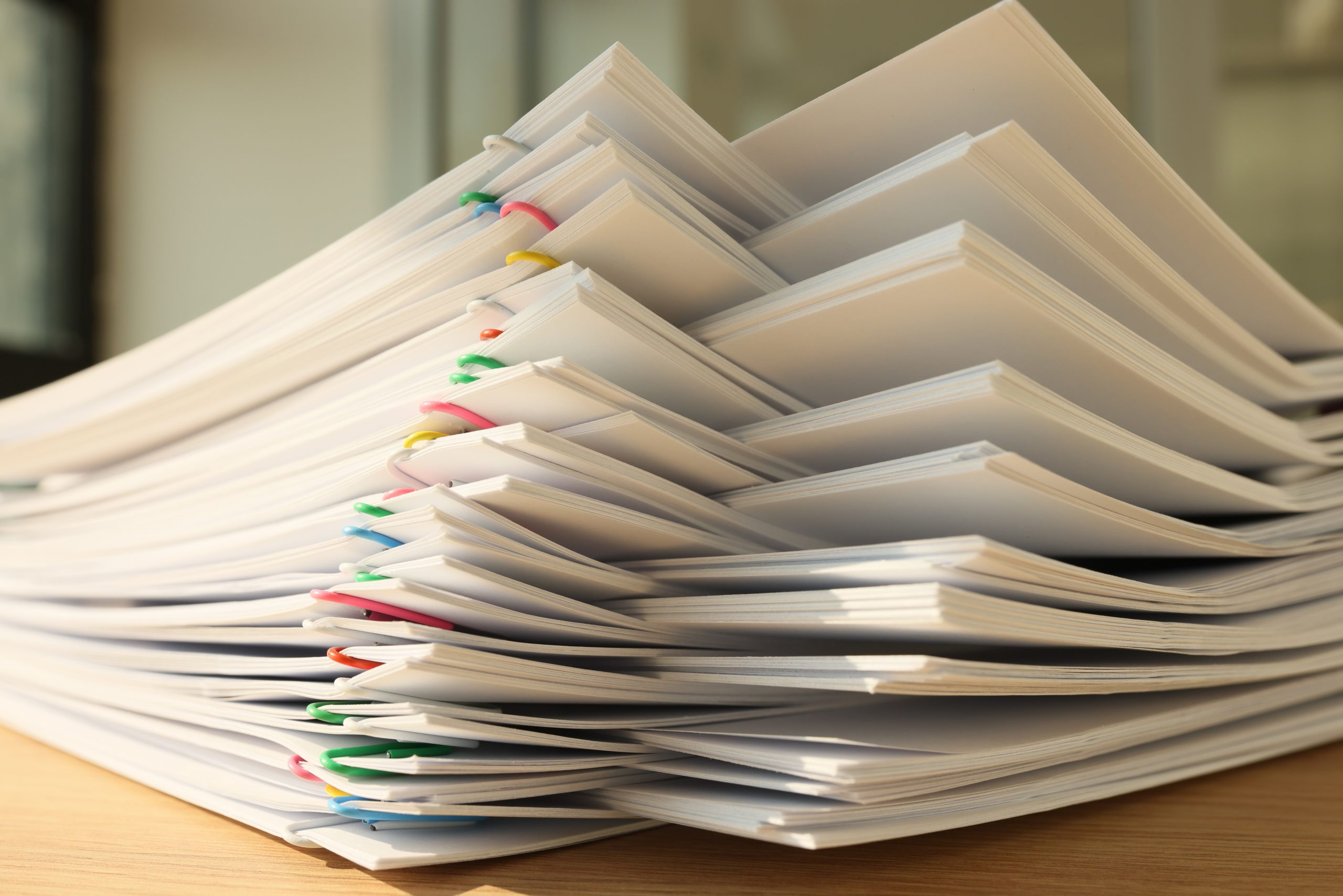 High stack of office documents